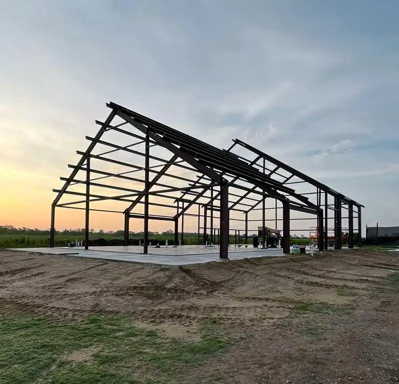 Barndominium frame at sunset in Illinois